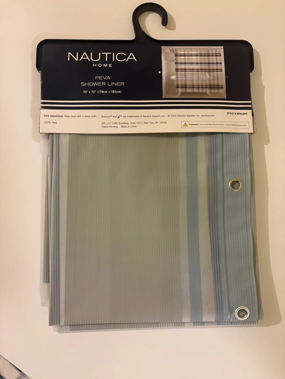 New in package. Nautica Shower Curtain Liner in Light Blue and Gray Stripes
